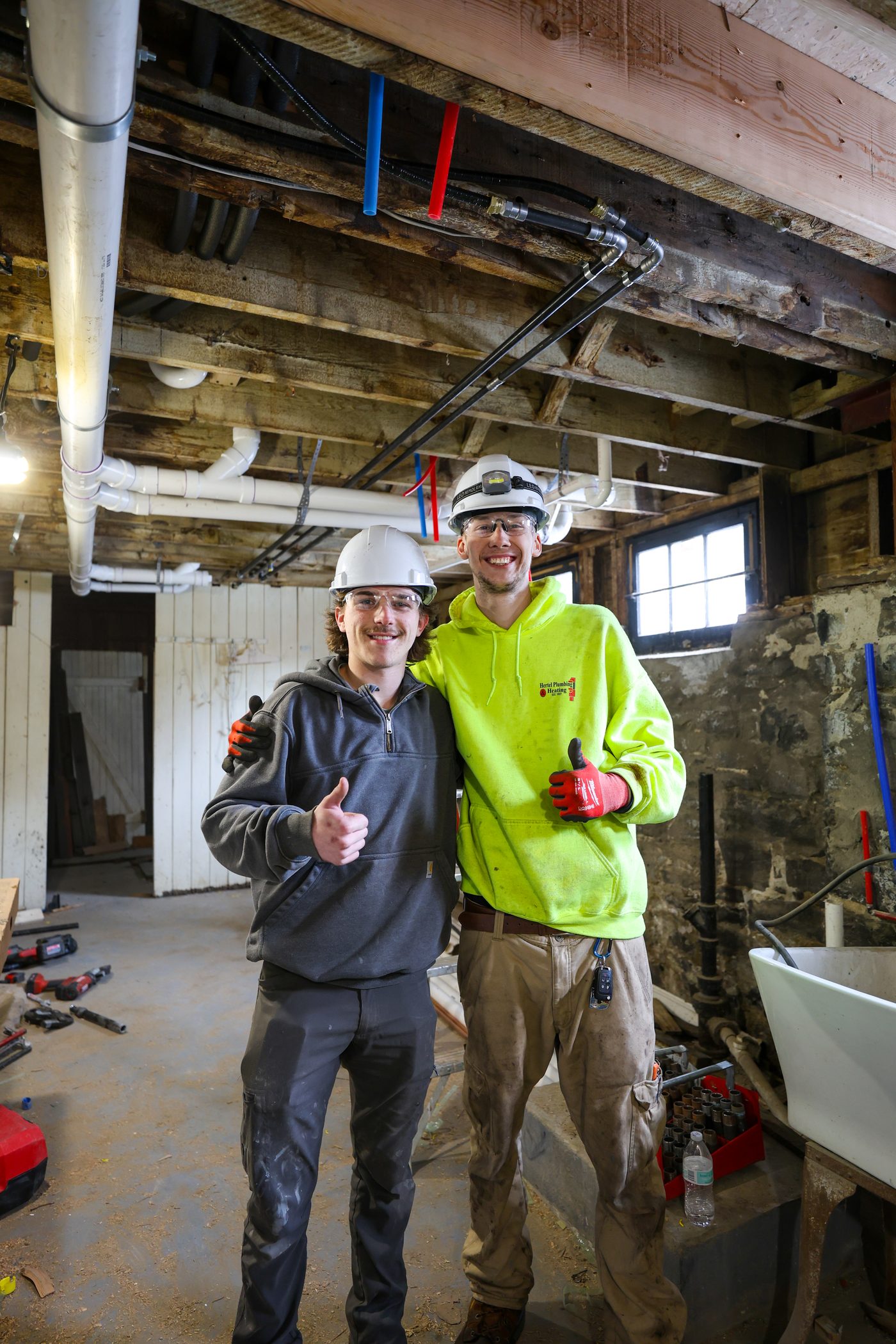 Hertel heating and cooling technicians on a job site