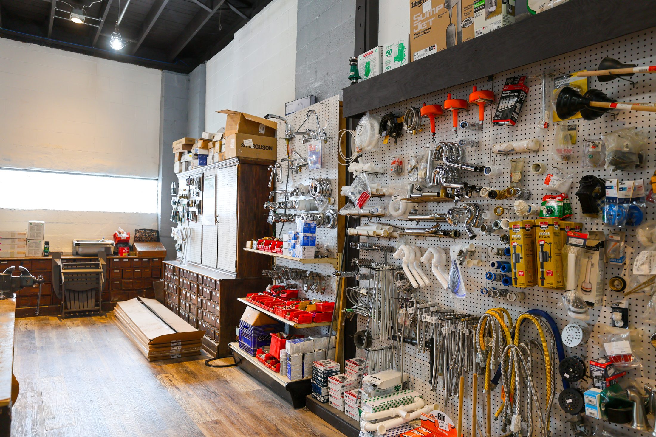 The hardware counter and plumbing supply wall at 250 Ramsdell Avenue