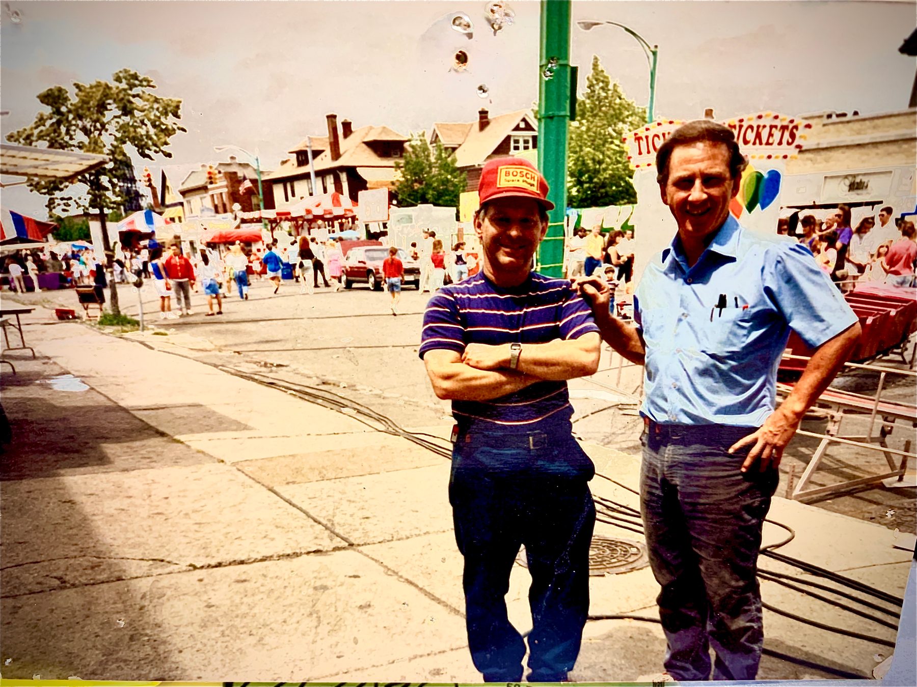 Archival photo of Bill Boy, left, and Anthony Christiano Sr. standing on a Buffalo street during a neighborhood festival.